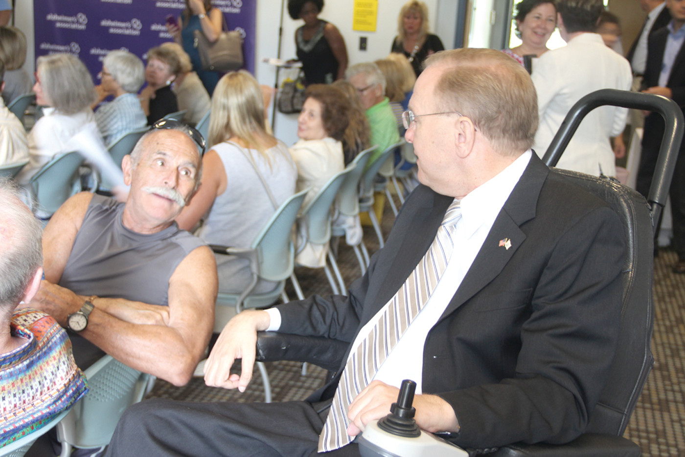HEARING HIS STORY: Congressman Jim Langevin talks with Samuel Nash of East Greenwich who is a caregiver for his wife who has Alzheimer’s.